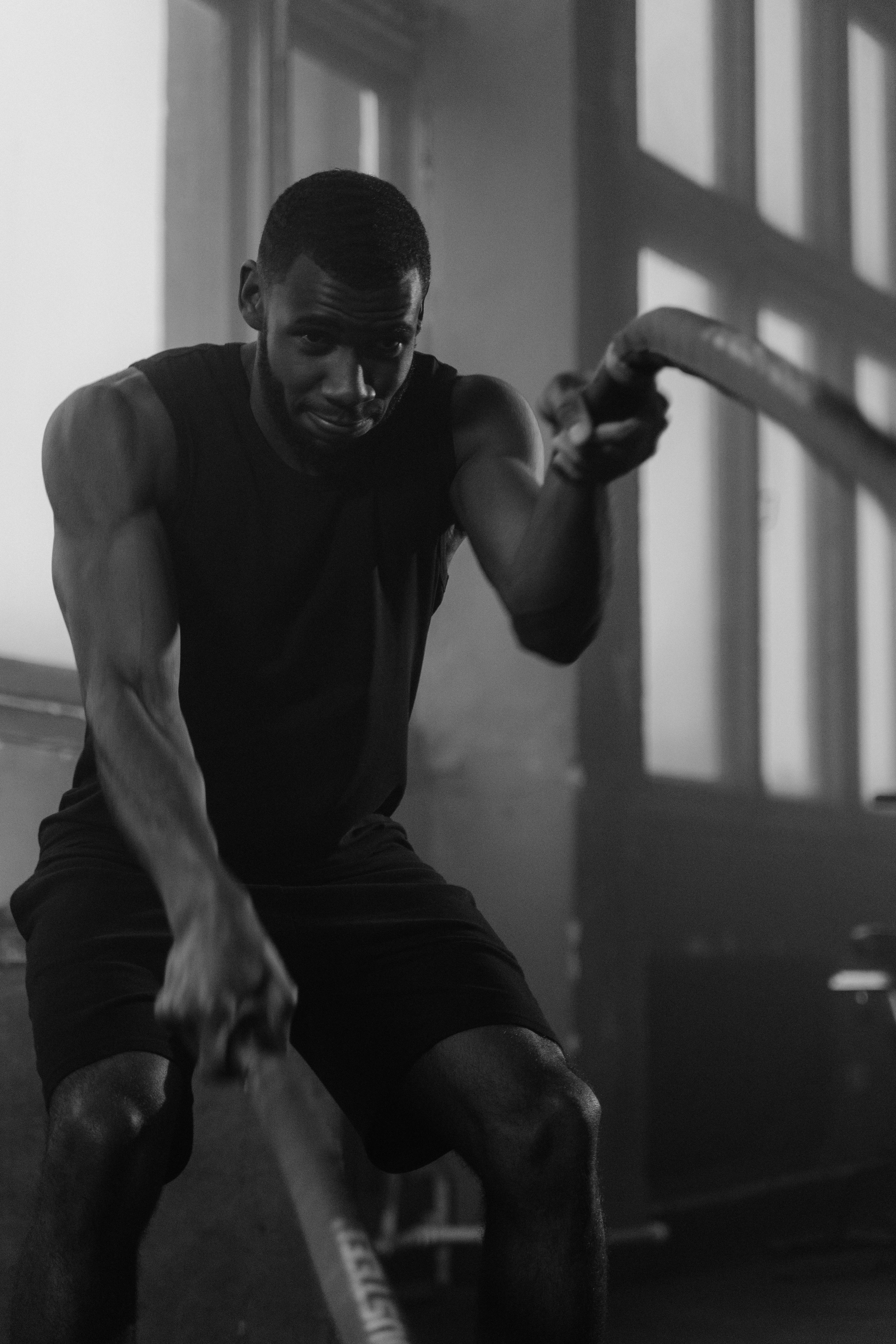 Athlete training with battle ropes